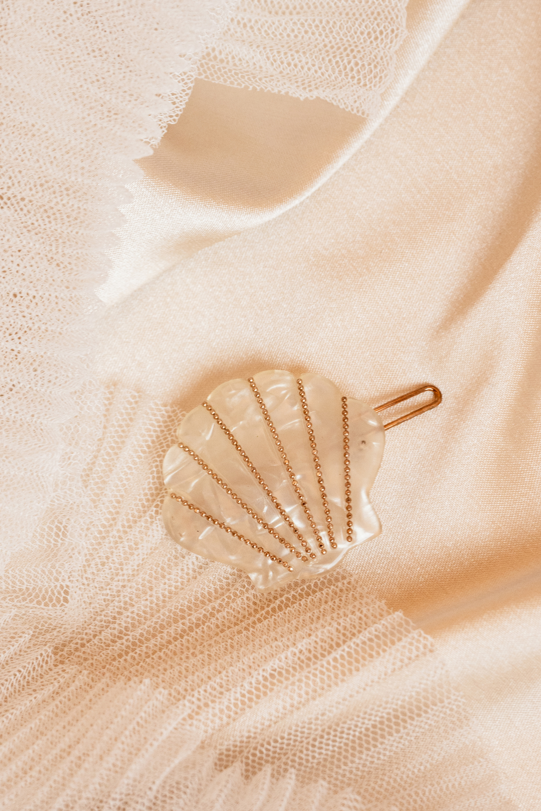 Seashell Hair Clip on Beige Silk Fabric